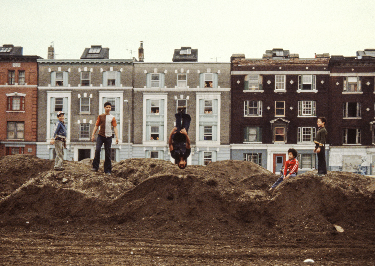 Playing on the dirt piles 1980